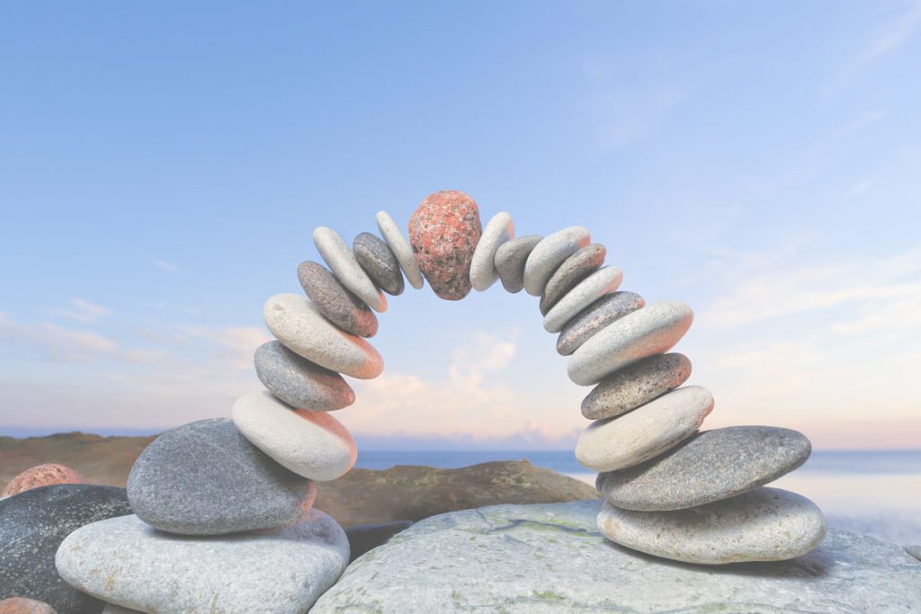 Pebbles making an arch image for estate planning for the modern family: cost effective solutions for transferring wealth in the UK blog